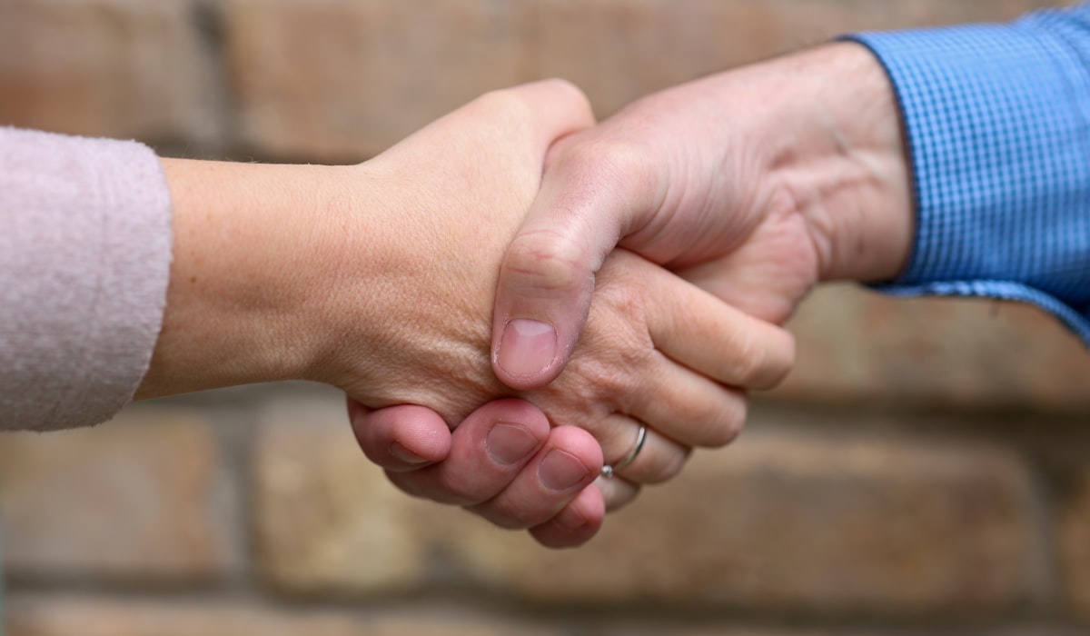 Business partnership handshake